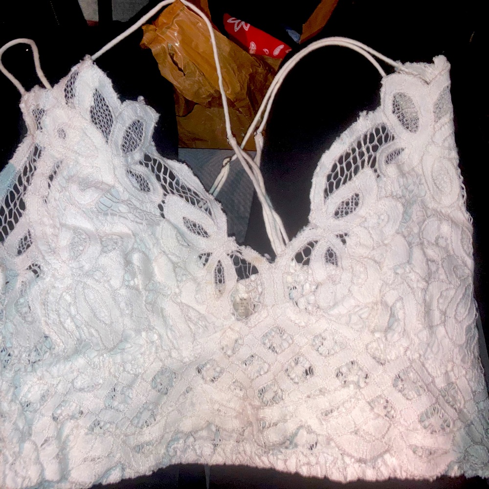 Crop top, I believe its a small or medium, White Lace, crossed in the back.